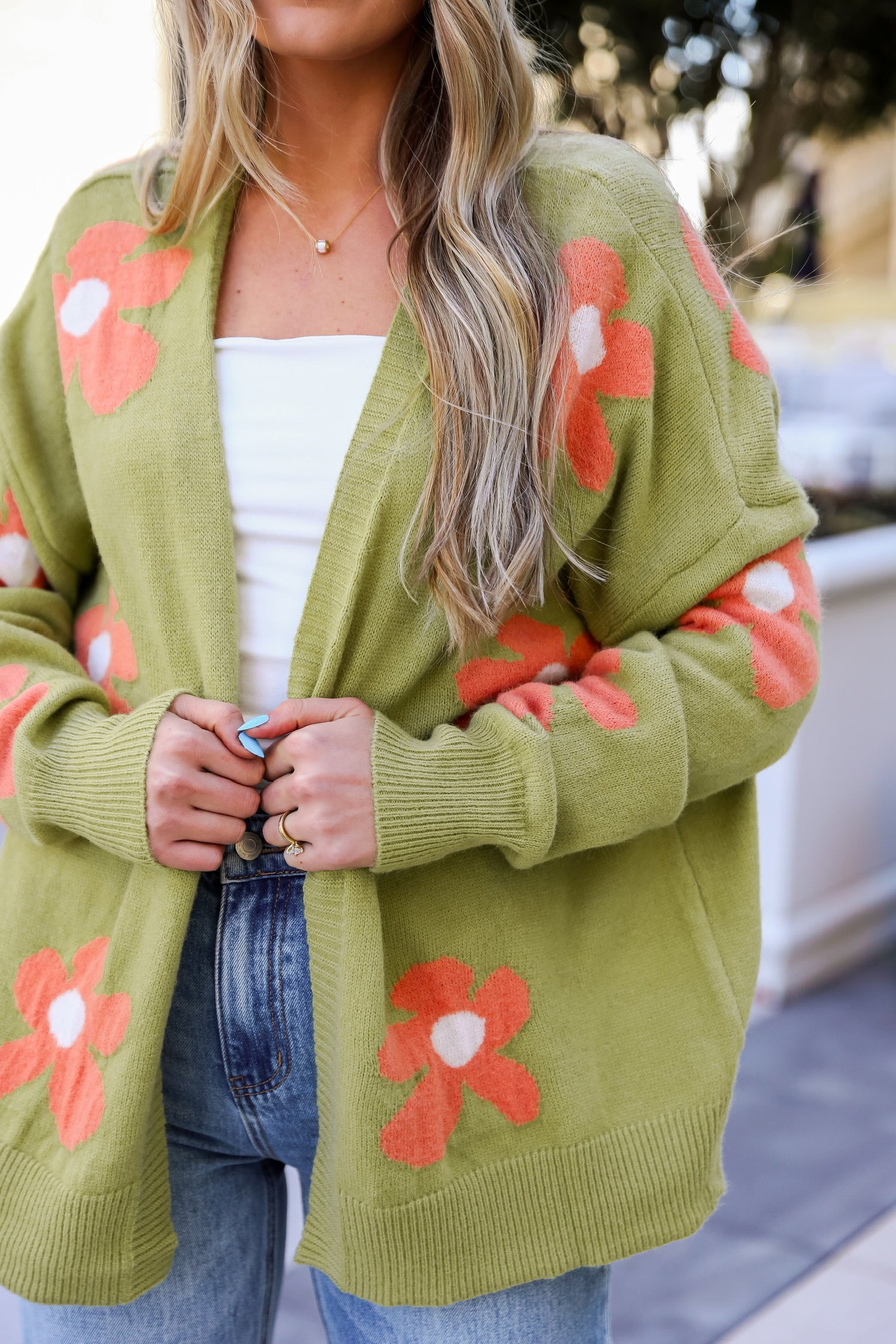 model wearing cute green floral cardigan