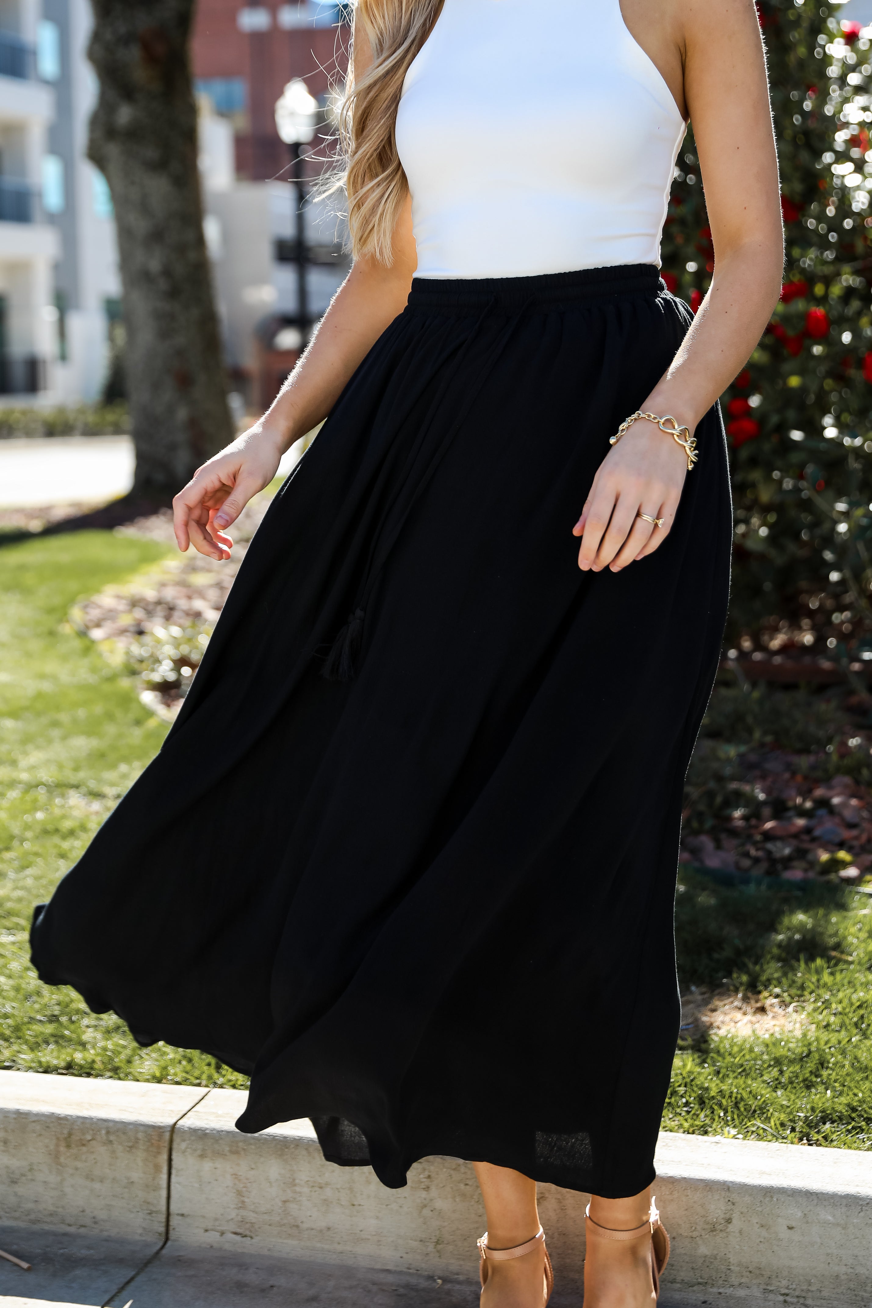 On My Mind Black Maxi Skirt has a flowy fit, elastic waistband, high-waisted skirt. Cute black skirt for summer. Pair with cute sandals, spring break outfit. online boutique 