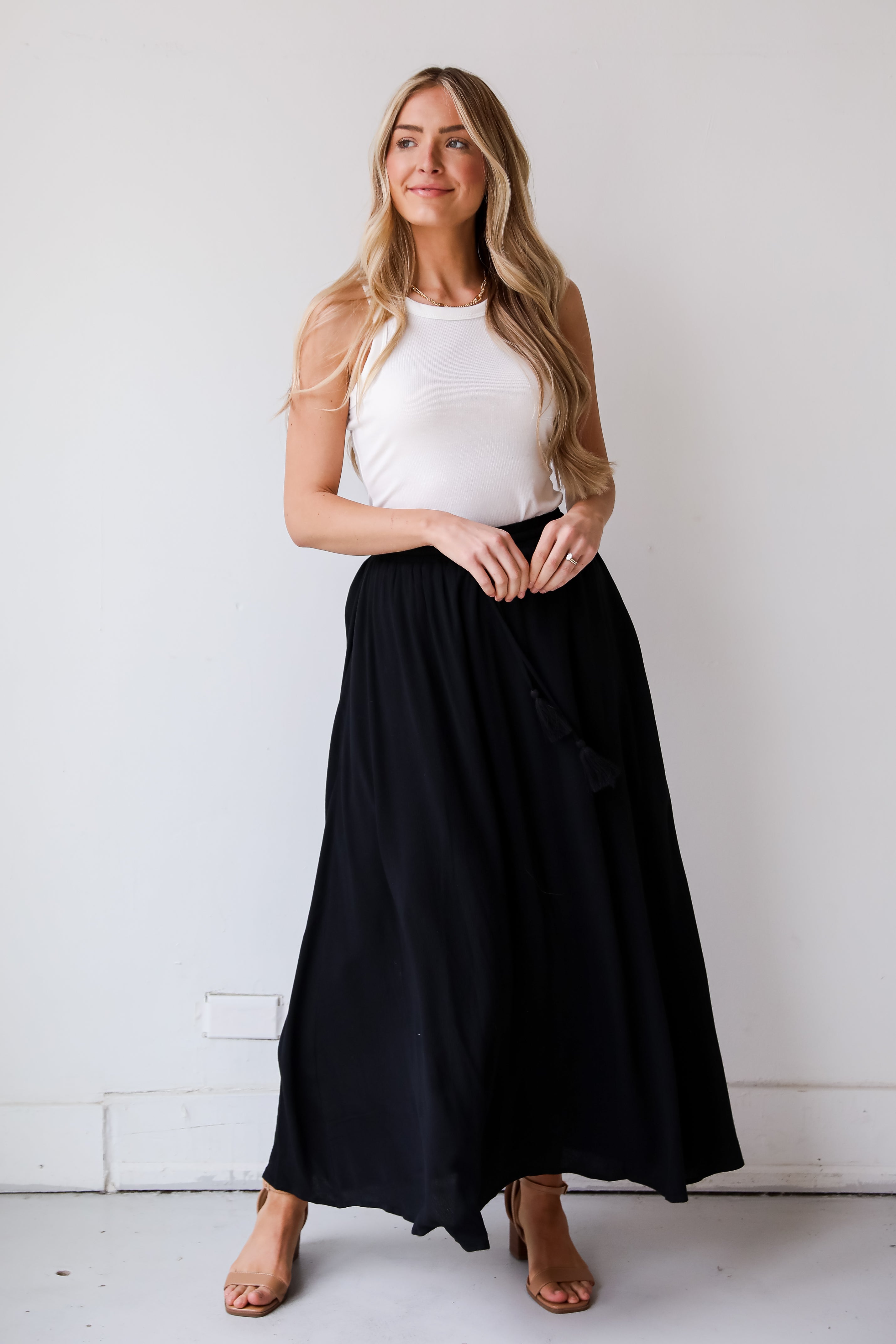 On My Mind Black Maxi Skirt has a flowy fit, elastic waistband, high-waisted skirt. Cute black skirt for summer. Pair with cute sandals, spring break outfit. online boutique 