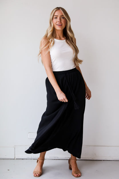 On My Mind Black Maxi Skirt has a flowy fit, elastic waistband, high-waisted skirt. Cute black skirt for summer. Pair with cute sandals, spring break outfit. online boutique 