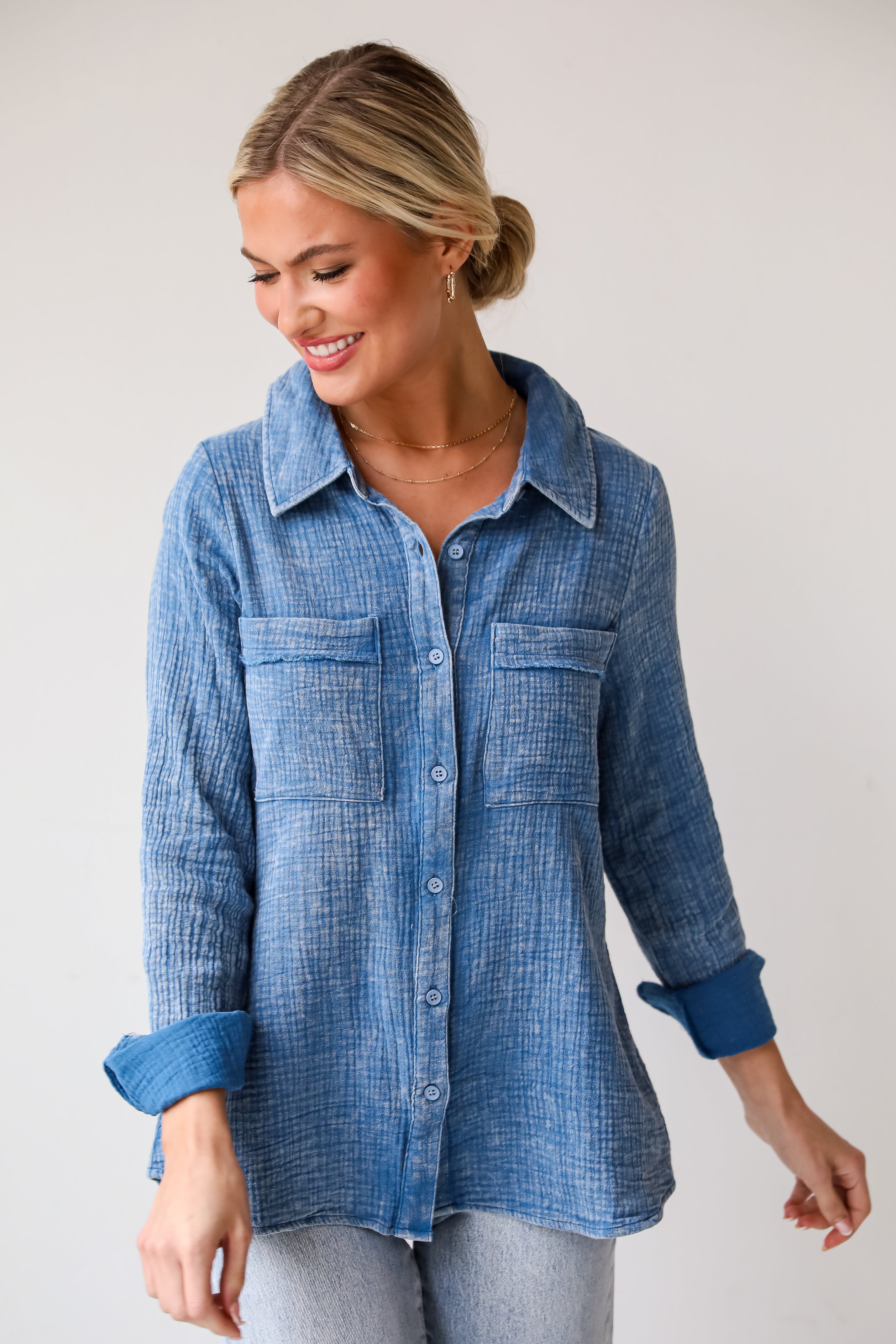 Morgan Denim Linen Button-Up Blouse features, Lightweight Crinkle Linen Fabrication, Acid Washed, Collared Neckline, Functional Button Front long Sleeves with Functional Button Cuffs