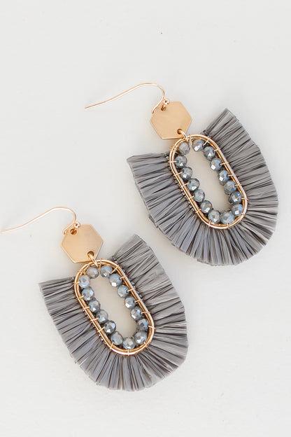 flat lay of Fringe Statement Earrings