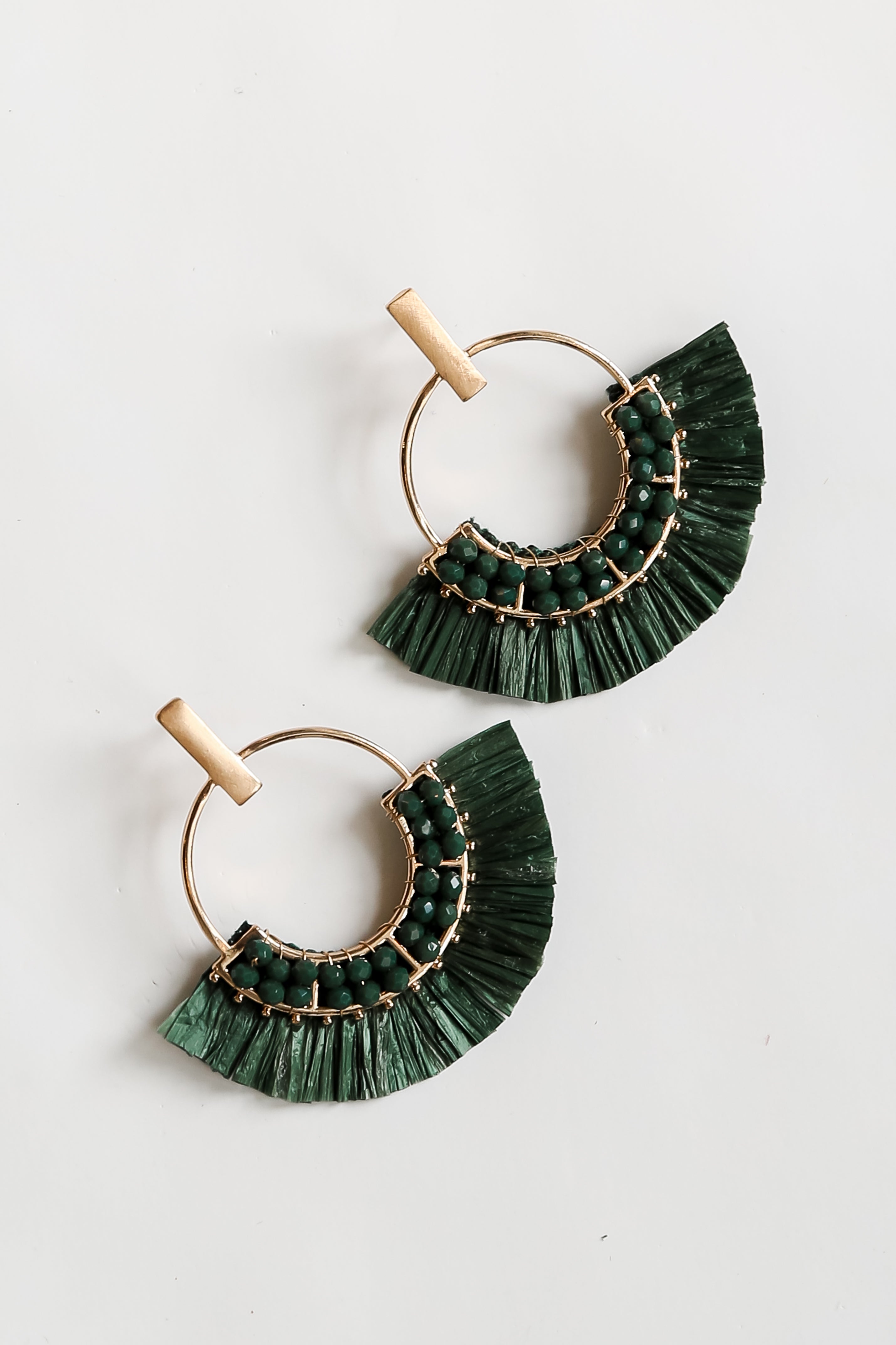 green Fringe Statement Earrings flat lay