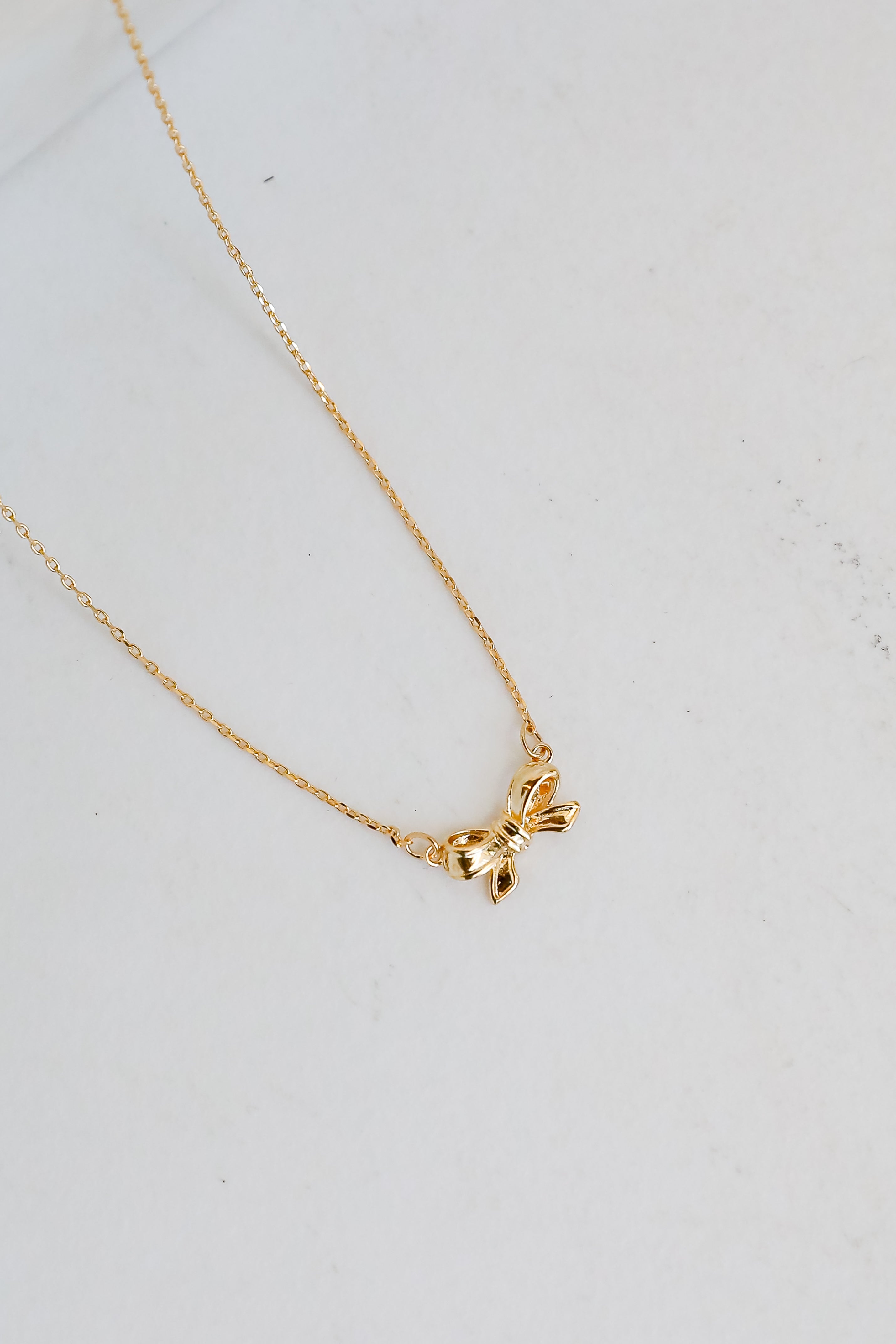 Brooke Gold Bow Charm Necklace