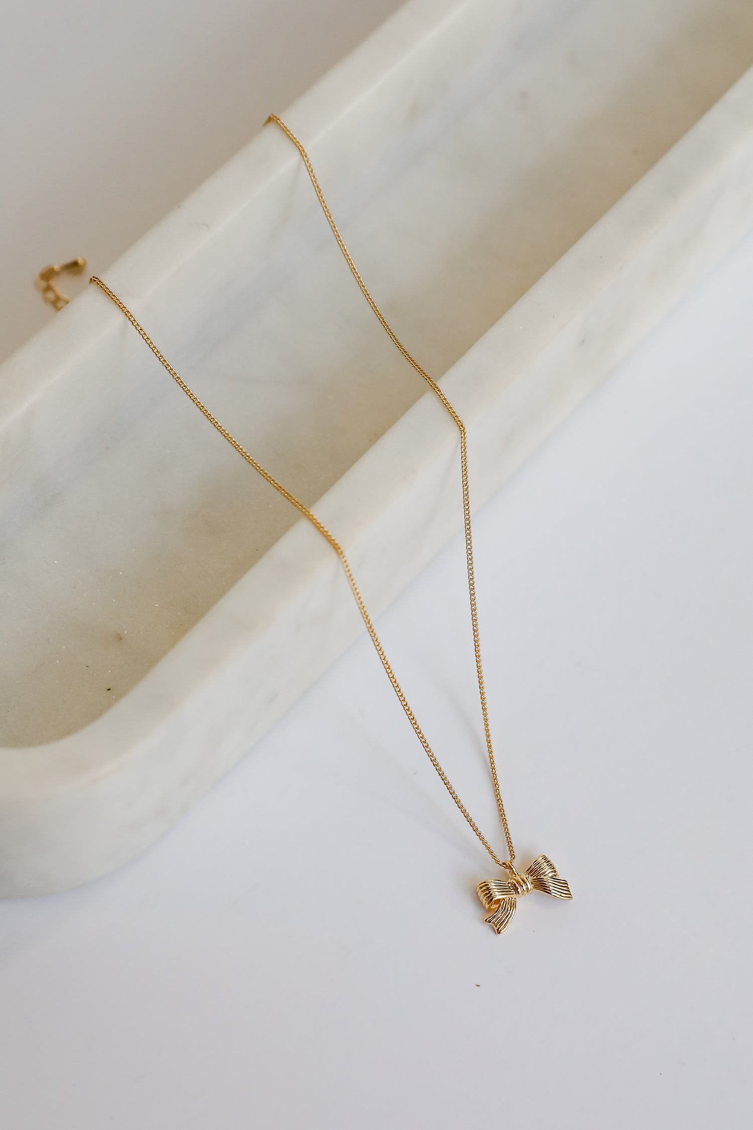 Gemma Gold Bow Charm Necklace