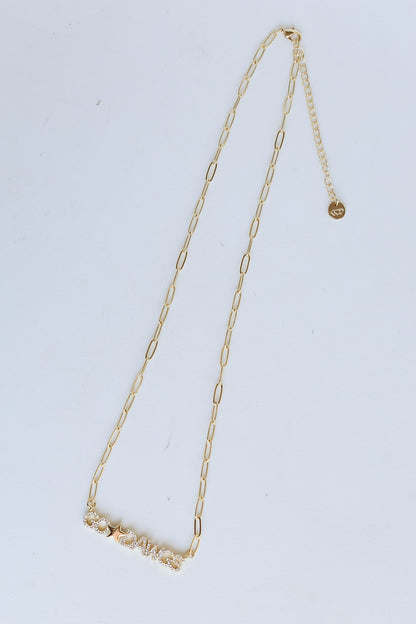 Gold Go Dawgs Necklace flat lay