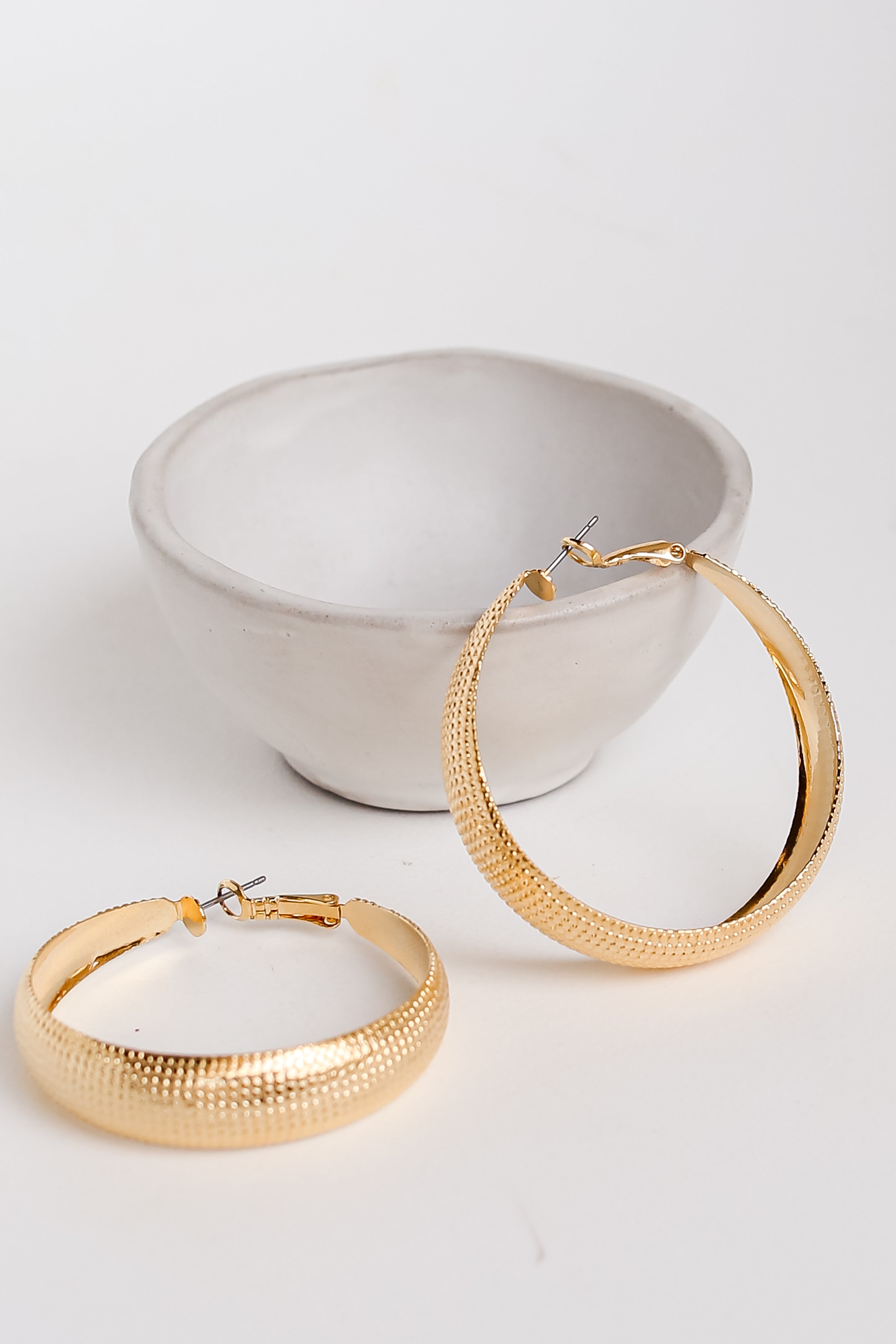 Gold Textured Hoop Earrings flat lay