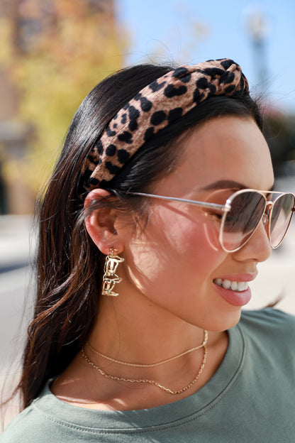 Gold Cowboy Boot Hoop Earrings on model