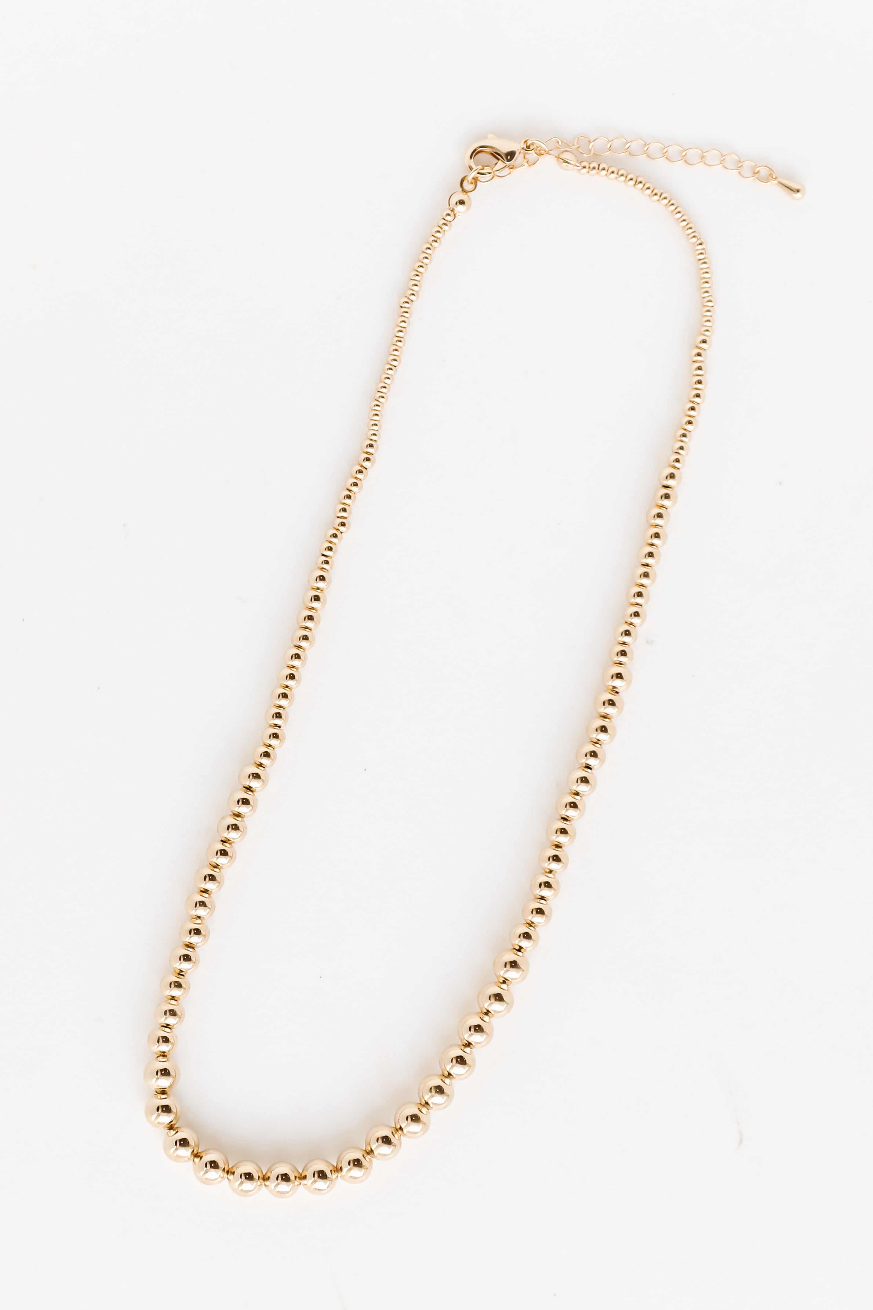 Gold Beaded Necklace flat lay