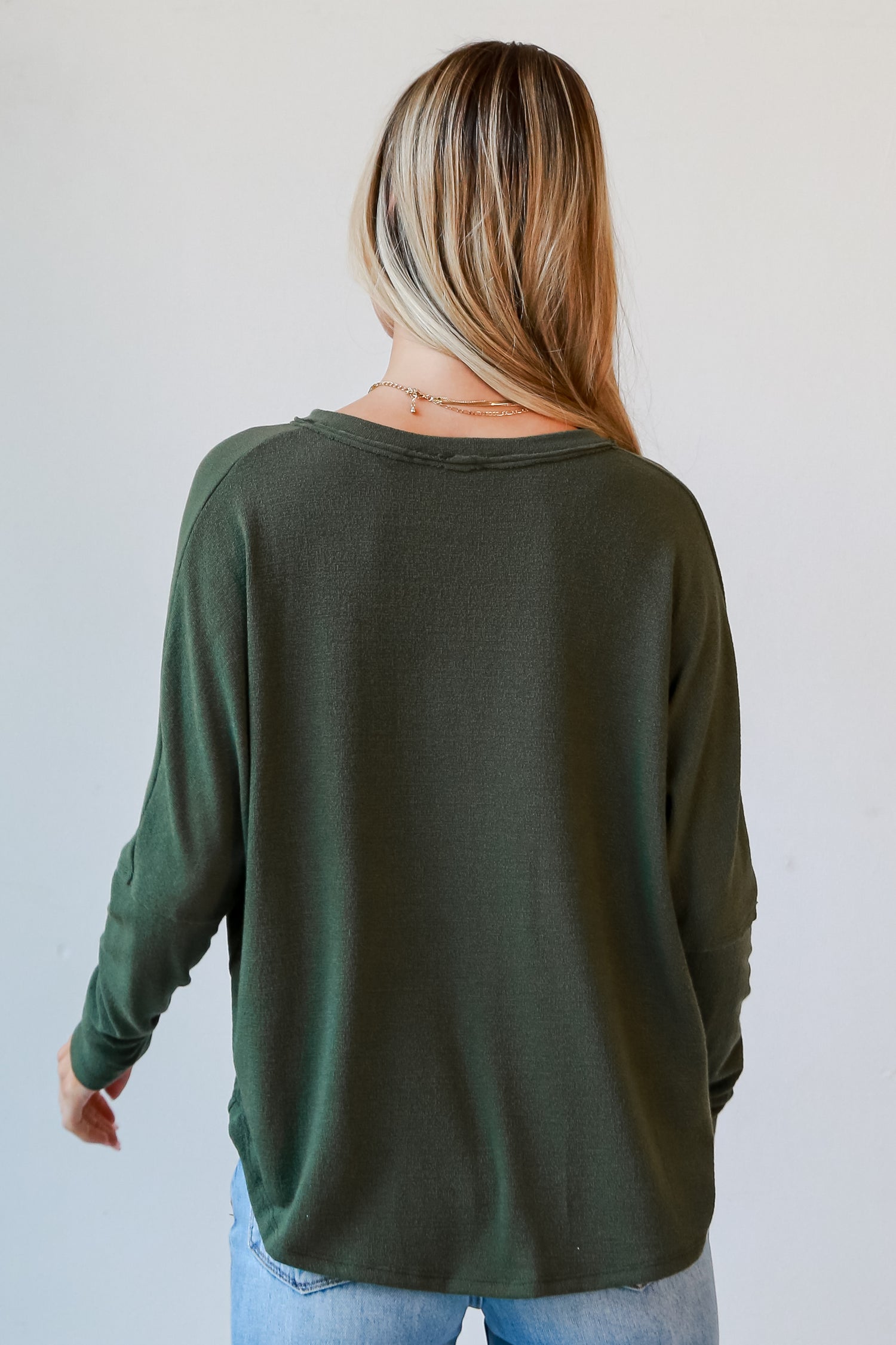 green knit top