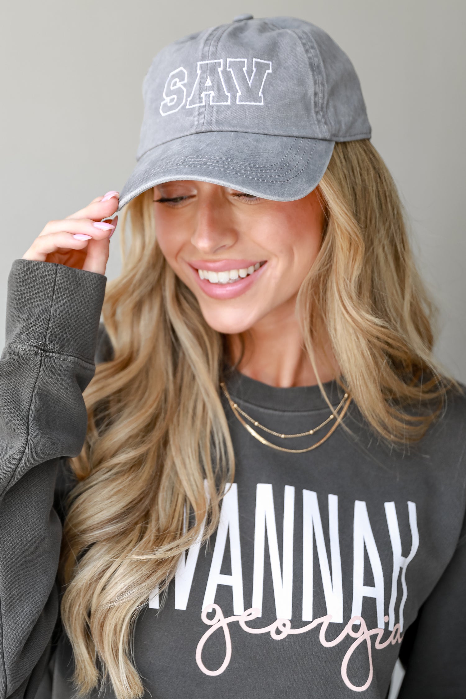 grey SAV Embroidered Hat on model