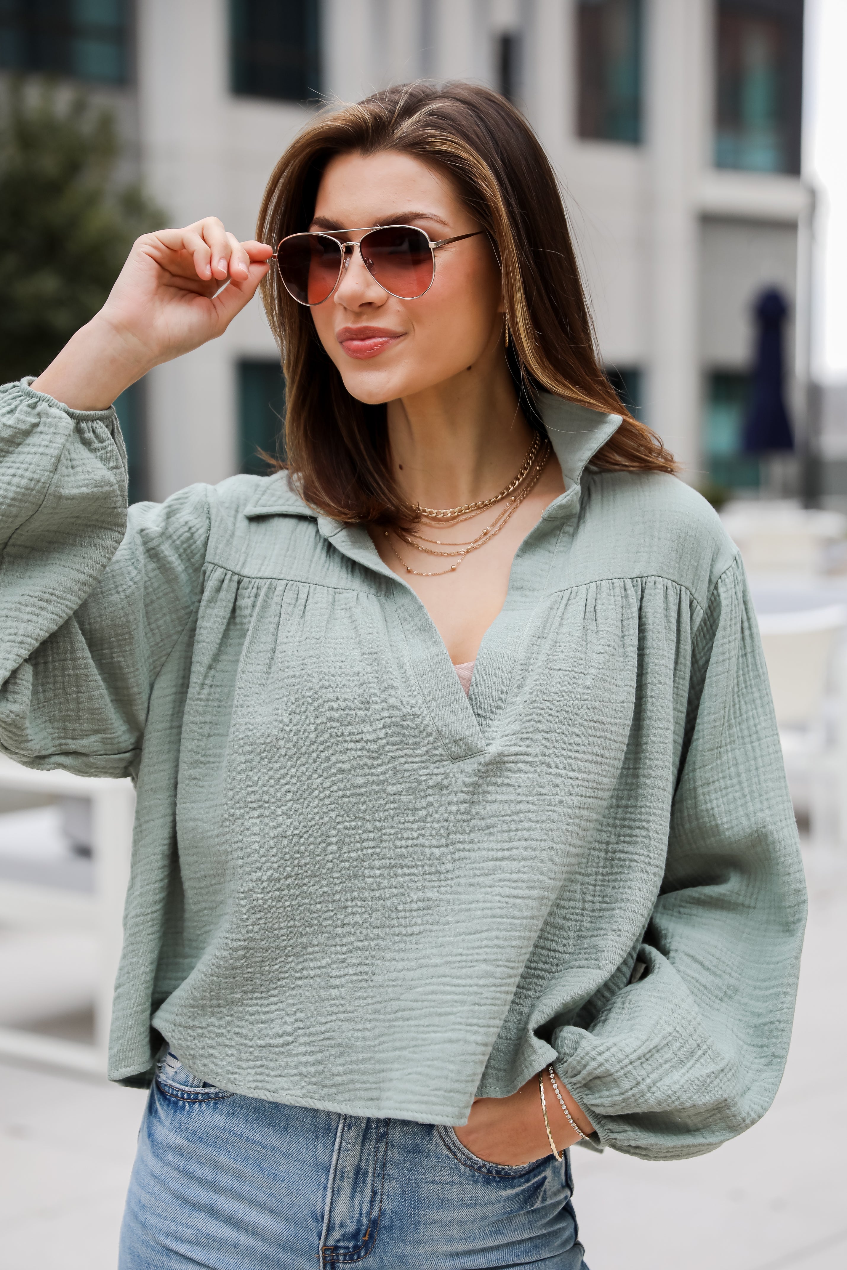 Alanna Linen Blouse is a Lightweight Crinkle Linen top, with a Collared V-Neckline, Long Balloon Sleeves with Elastic Cuffs. Relaxed Fit, 100% Cotton, and the perfect shade of blue and white. boutique tops. Women tops for summer. 