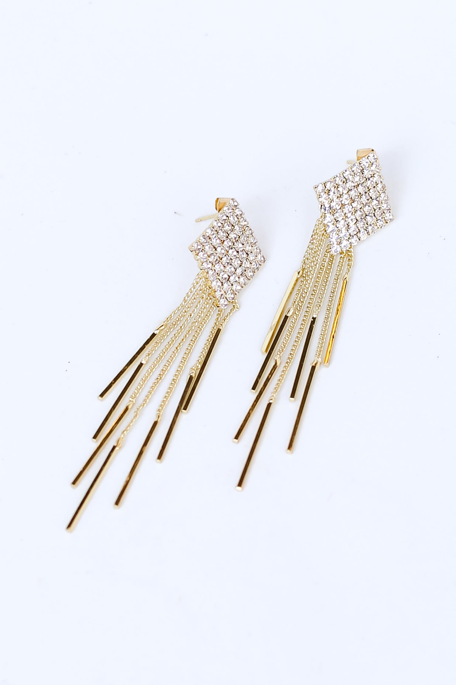 Gold Rhinestone Fringe Statement Earrings flat lay