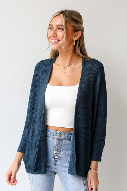 teal lightweight knit Cardigan on model with white tank