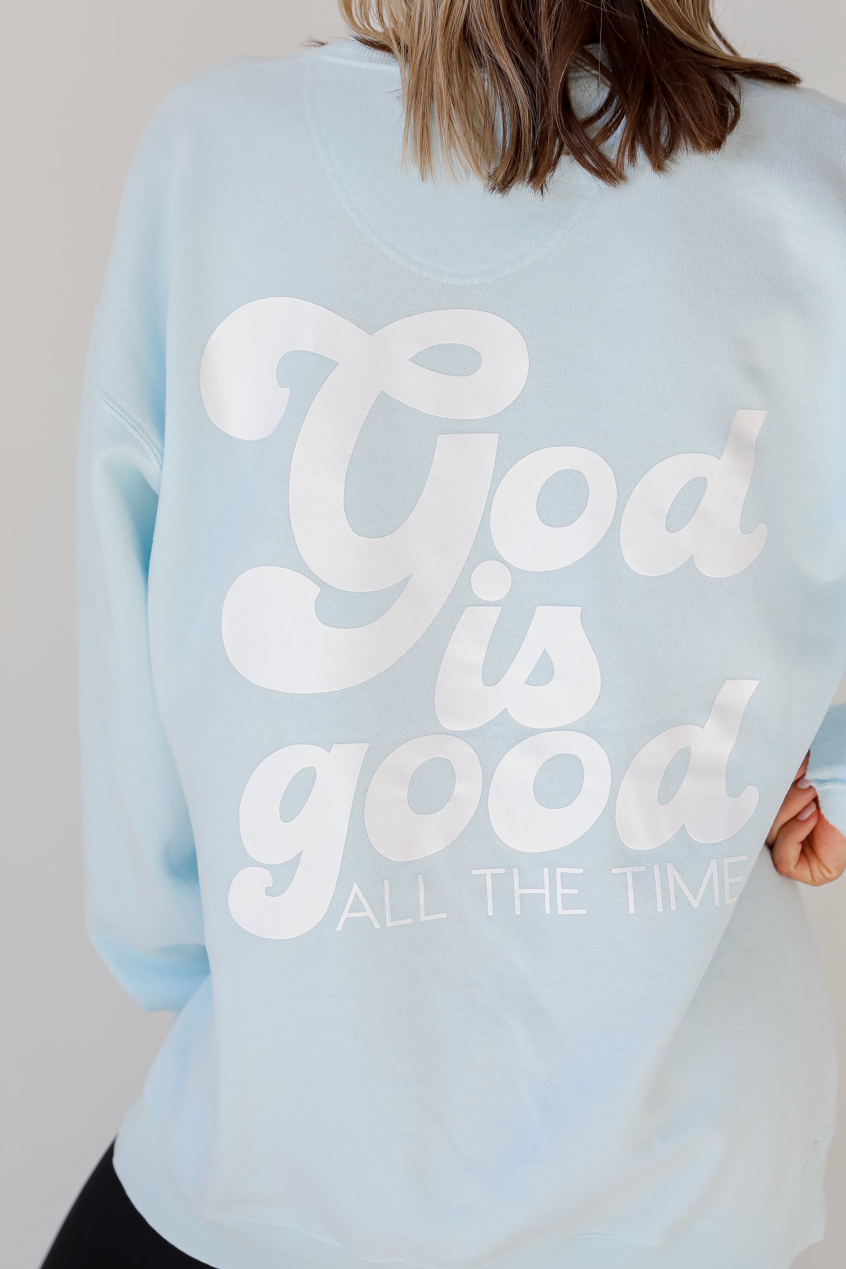 Light Blue God Is Good Cross Pullover on model