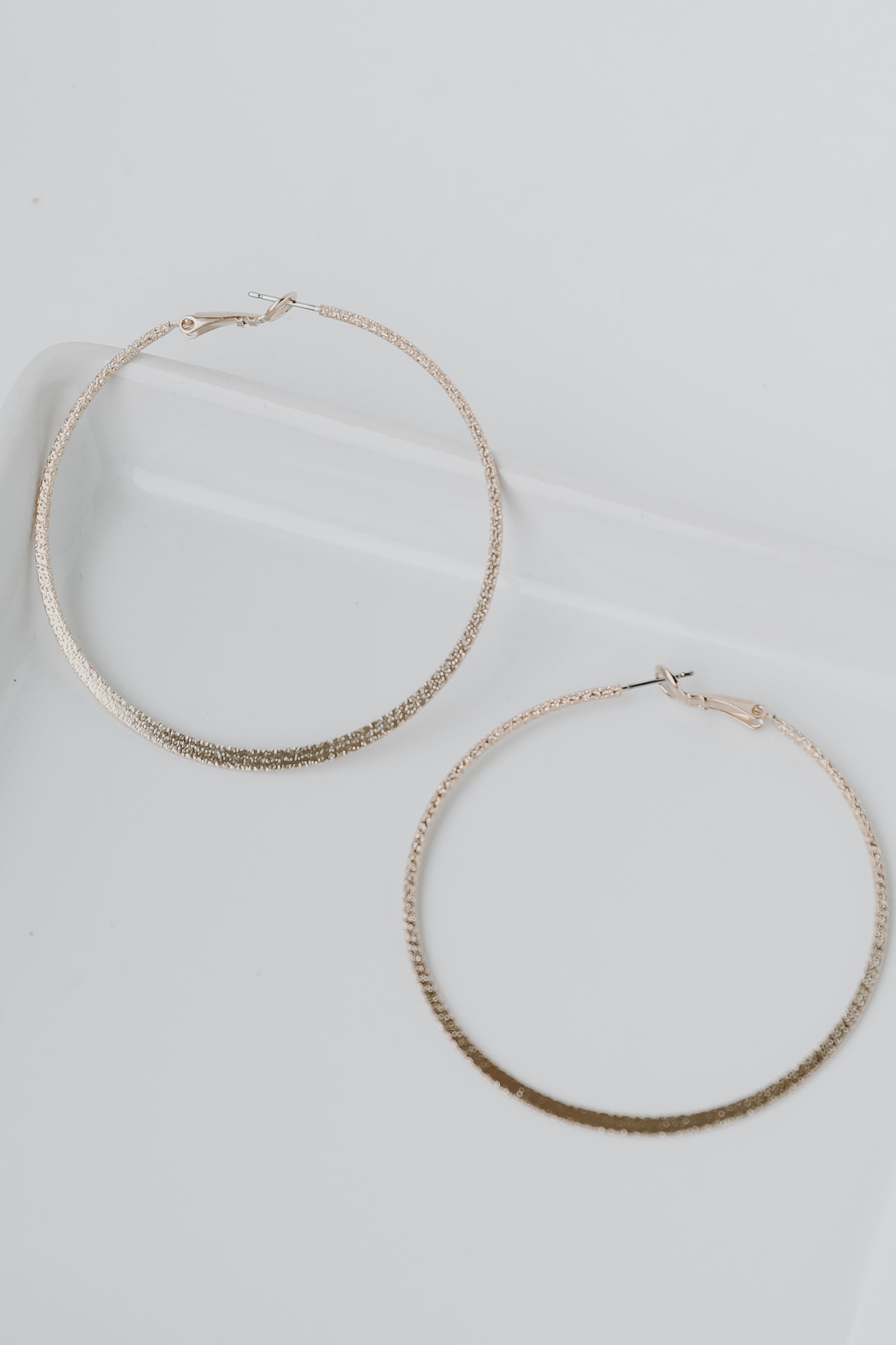 Gold Textured Hoop Earrings flat lay