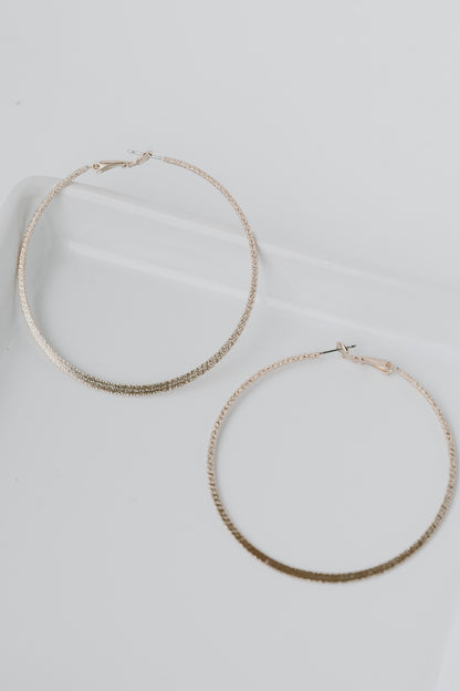 Gold Textured Hoop Earrings flat lay